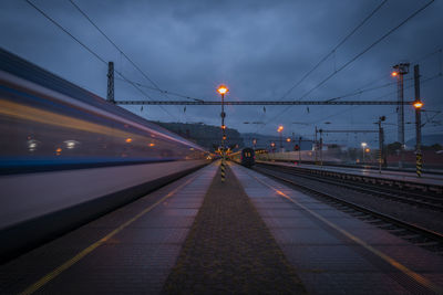 People walking on railroad station platform