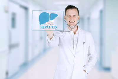 Digital composite image of doctor with icon in hospital