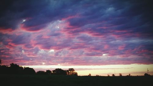 Scenic view of landscape against cloudy sky