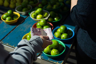 High angle view of man holding fruit