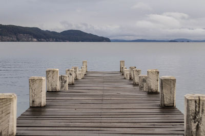 Pier over sea against sky