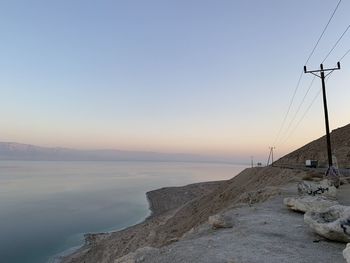 Scenic view of sea against clear sky during sunset