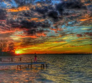 Scenic view of sea against cloudy sky