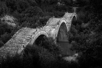 Arch bridge over old building