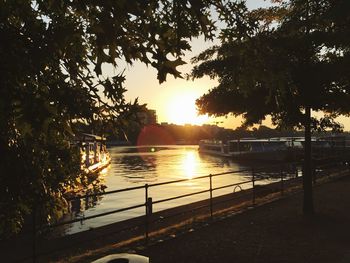 Scenic view of river at sunset