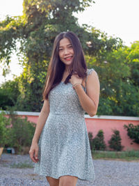 A asian nationality thai woman wearing blue dress and feel good