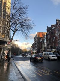 City street and buildings against sky