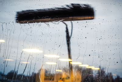 Close-up of wet glass window in rainy season