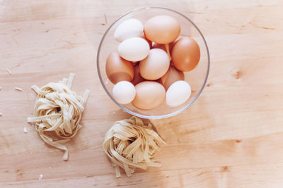 High angle view of eggs in bowl on table