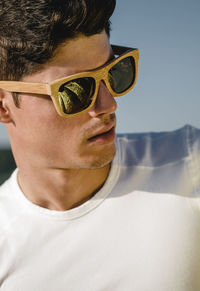 Close-up of fashionable young man wearing sunglasses during summer