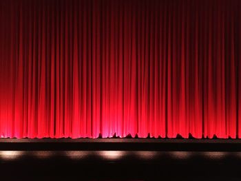 Red closed curtains on stage