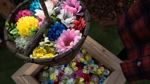 High angle view of multi colored flowering plants in basket