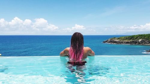 Rear view of woman in swimming pool