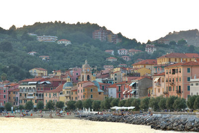 The ligurian  village and the beach populated after sunset.