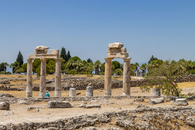 Built structure on field against clear sky