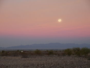 Scenic view of landscape against sky during sunset