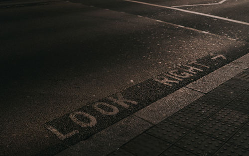 High angle view of text on road at night