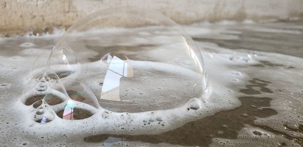 Close-up of bubbles on beach