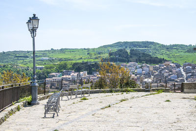 View of street and buildings against sky