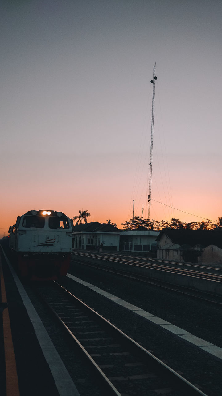 TRAIN AGAINST SKY DURING SUNSET