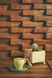 Coffee in cup on table at cafe