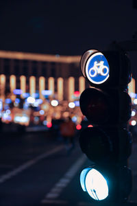 Close-up of illuminated road signal at night