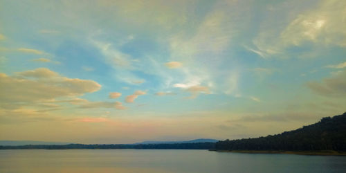 Scenic view of lake against sky during sunset