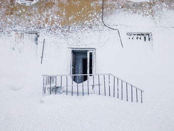 Entrance of snow covered house