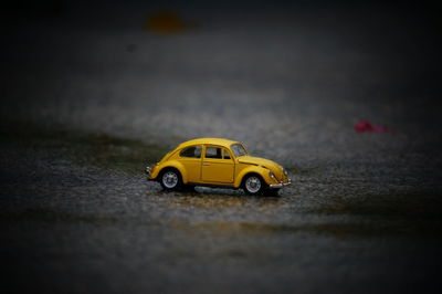Close-up of toy car on street