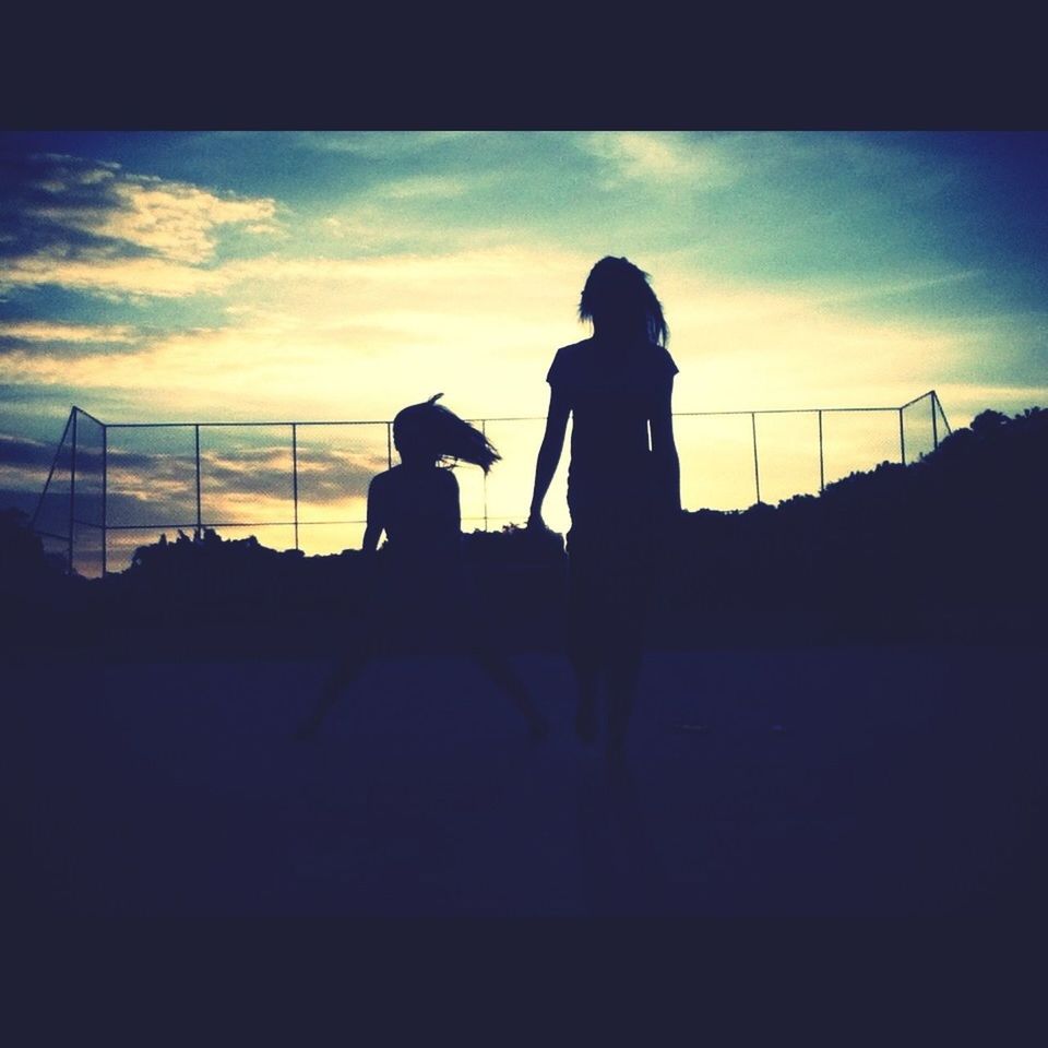 silhouette, sky, sunset, men, lifestyles, cloud - sky, leisure activity, togetherness, standing, cloud, outline, full length, bonding, person, dusk, nature, outdoors