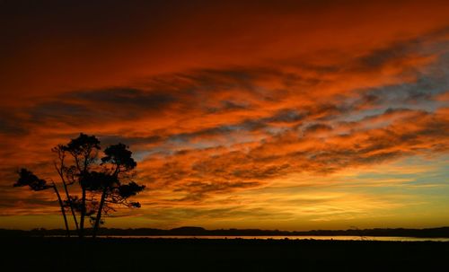 Scenic view of landscape at sunset