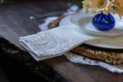 Close-up of white flower in plate on table