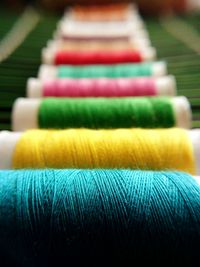 Close-up of colorful thread spools