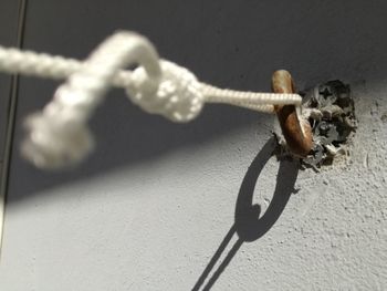 Close-up of rope tied on wall