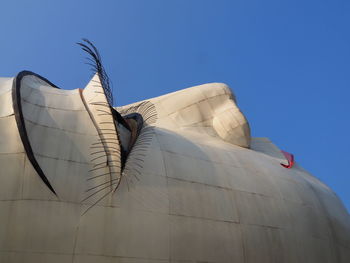 Low angle view of building against clear blue sky