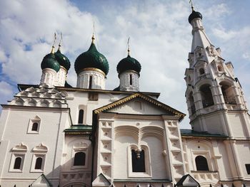 Low angle view of church against cloudy sky