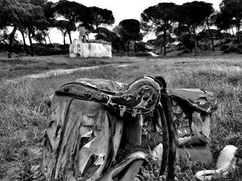 Abandoned car on field