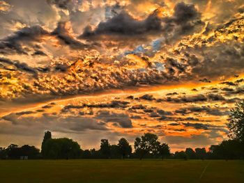 Scenic view of landscape against cloudy sky