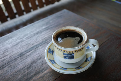 High angle view of coffee cup on table