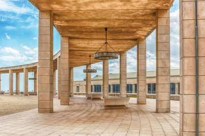 Corridor of historic building against sky