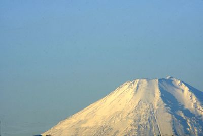 Scenic view of mountains against blue sky