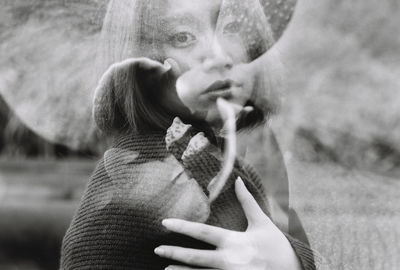 Double exposure of teenage girl and flower