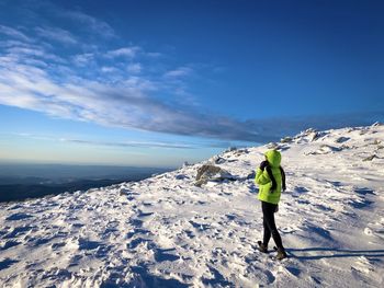 Woman wearing warm clothes in a winter scenery