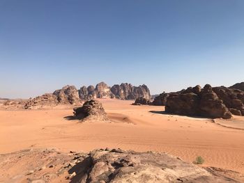 Rock formations in desert against clear sky