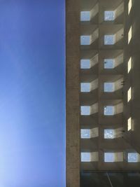 Low angle view of building against blue sky