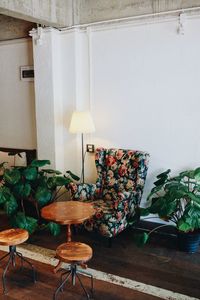 Empty chairs and table against wall at home