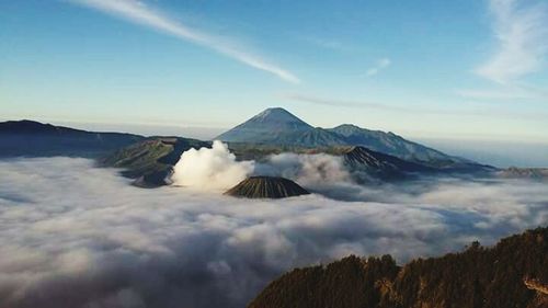 Scenic view of mountains against cloudy sky