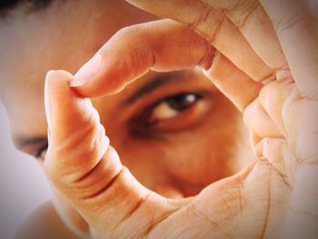 Close-up portrait of woman holding hands