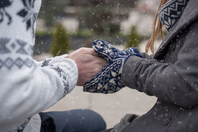 Close-up of woman hand in water