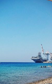 Scenic view of calm sea against clear sky